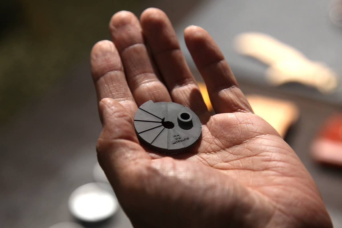 Artisan With Weathered Hands Holding An Intricate Concrete Watch Dial