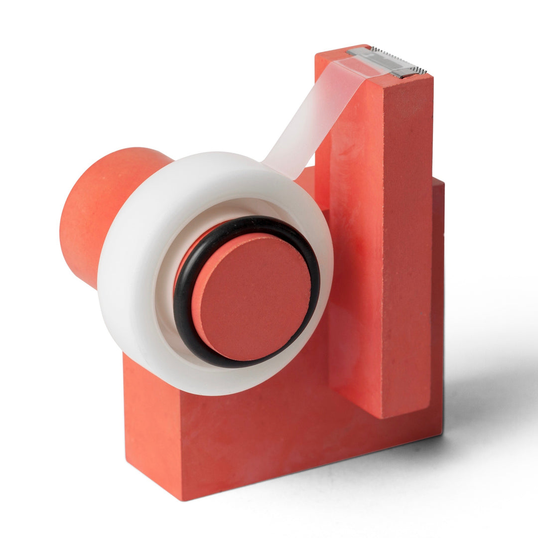 Red MERGE tape dispenser with tape in use