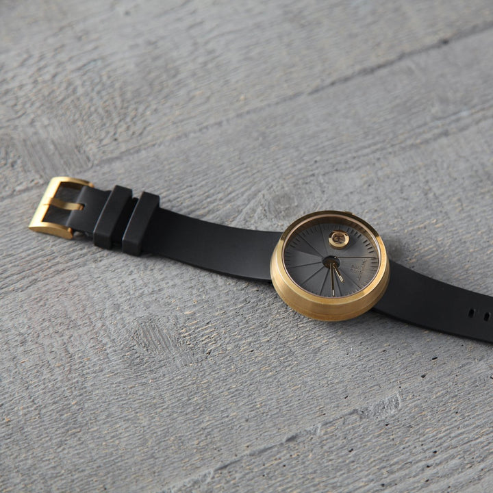 22STUDIO Concrete Watch With A Black Band And Gold Buckle