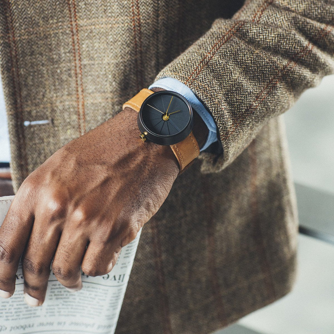 Man With A Brown Sport Coat Wearing A Black Modern Watch With A Caramel Italian Leather Strap