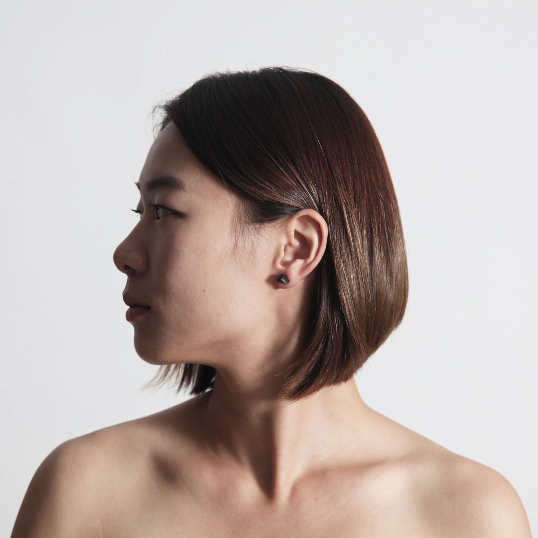 Female Model Wearing A 22STUDIO Concrete Rock Earring