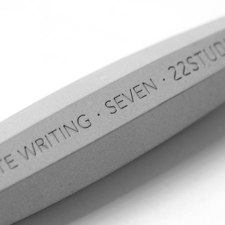 Close-Up View of Engraving On A 22STUDIO Concrete Seven Sketch Pencil